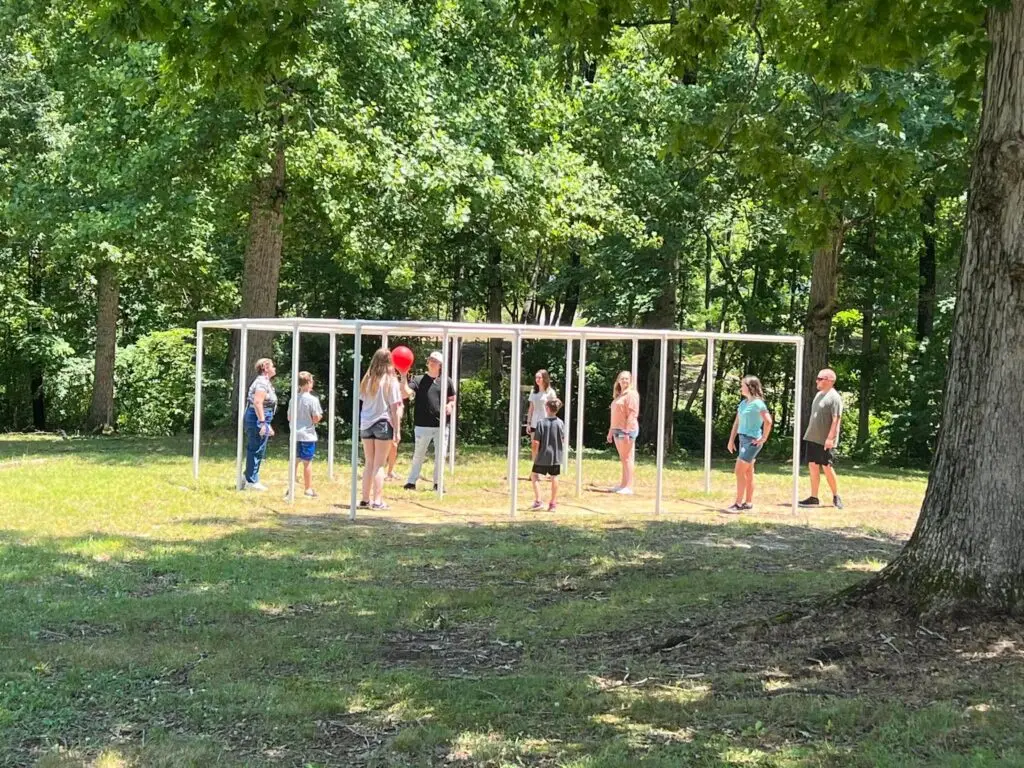 Campers playing 9 Square on the lawn