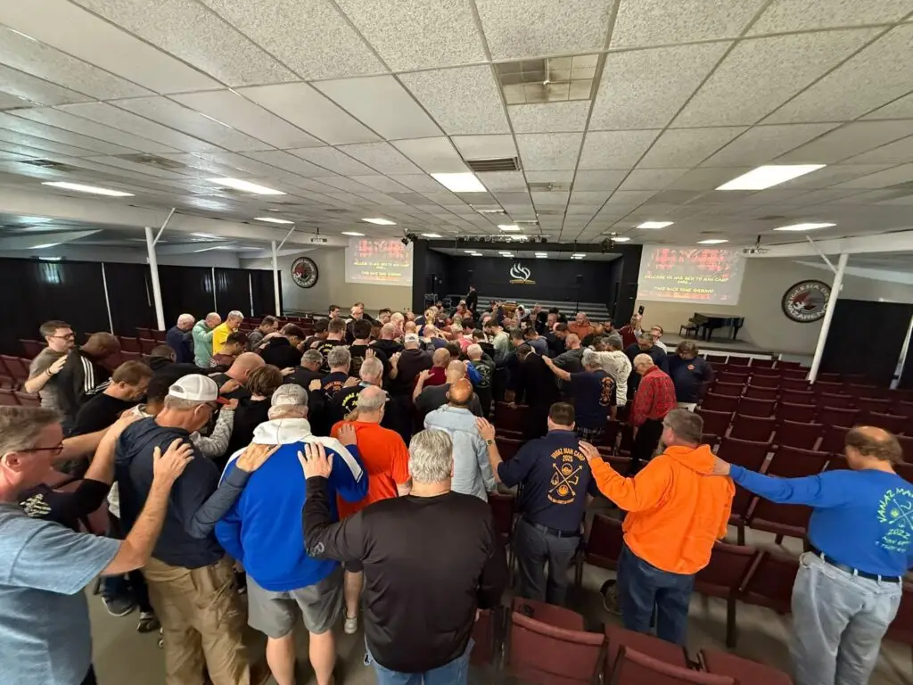 Crowd standing during worship