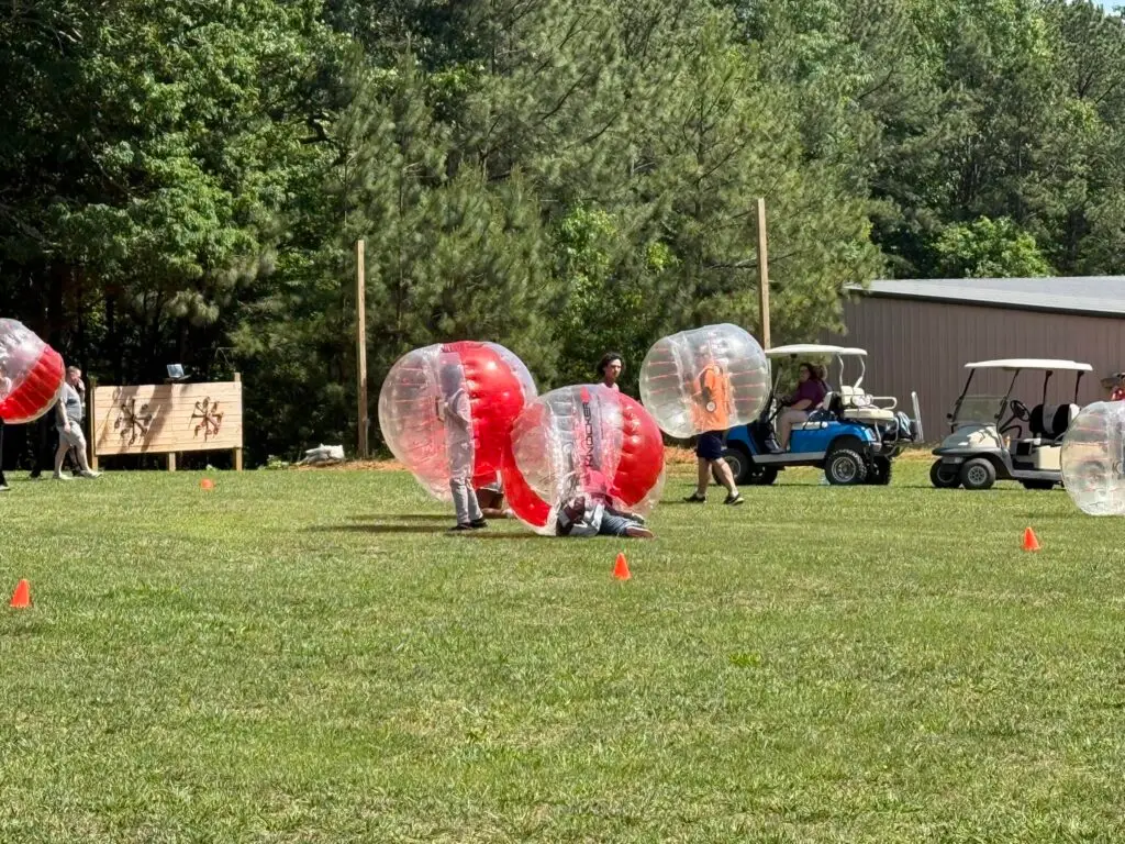 Campers playing knockerball on the field